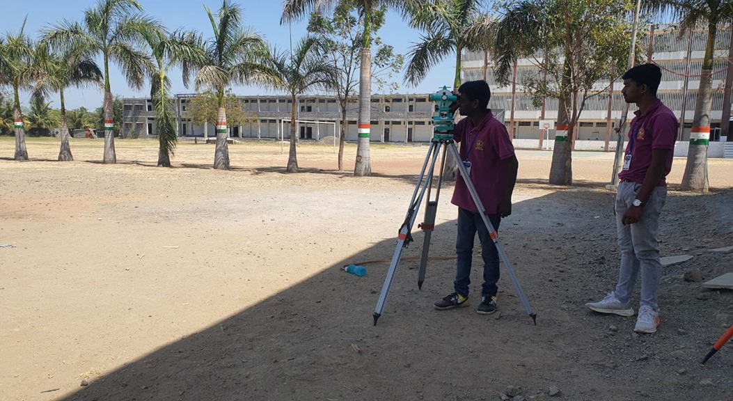 Civil Engineering students using surveying equipment